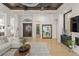 Inviting living room featuring hardwood floors, high ceilings, and comfortable furniture with ample natural light at 11754 Waterstone Loop Dr, Windermere, FL 34786