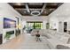 Bright living room featuring a decorative ceiling, a large sectional couch, and sliding glass doors to the backyard at 11754 Waterstone Loop Dr, Windermere, FL 34786