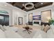 Bright living room with a coffered ceiling, fireplace, comfortable seating, and tile floors at 11754 Waterstone Loop Dr, Windermere, FL 34786