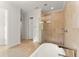 Luxurious main bathroom with a glass shower and a freestanding bathtub at 11754 Waterstone Loop Dr, Windermere, FL 34786