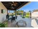 Inviting outdoor dining space with a covered patio, perfect for entertaining and relaxation at 11754 Waterstone Loop Dr, Windermere, FL 34786