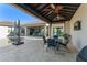 Charming outdoor dining area with ceiling fans and views of the pool and backyard at 11754 Waterstone Loop Dr, Windermere, FL 34786