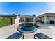 Serene backyard featuring a sparkling pool, spa, and well-maintained patio area at 11754 Waterstone Loop Dr, Windermere, FL 34786