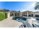Beautiful backyard pool and spa surrounded by ample patio space and lush greenery at 11754 Waterstone Loop Dr, Windermere, FL 34786