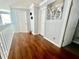 Upstairs hallway with wood floors, white doors, and neutral wall color at 1212 Bradwell Dr, Orlando, FL 32837
