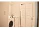 Bright laundry room featuring a modern, front load washer and dryer set and a closet with double doors at 1212 Bradwell Dr, Orlando, FL 32837