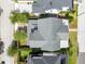 An overhead shot of a home with a gray roof, showcasing the backyard, landscaping, and neighborhood at 1410 W New Hampshire St, Orlando, FL 32804