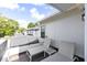 Relaxing balcony with patio furniture and scenic views of the surrounding neighborhood at 1410 W New Hampshire St, Orlando, FL 32804