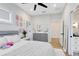 Bedroom featuring walk in closet, adjacent to bathroom with double vanity sinks, and modern decor at 1410 W New Hampshire St, Orlando, FL 32804
