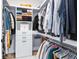 Organized walk-in closet features custom shelving, drawers, and ample hanging space for clothes and accessories at 1410 W New Hampshire St, Orlando, FL 32804