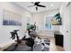 Bright exercise room features a Peloton bike, desk, and TV for a complete workout experience at 1410 W New Hampshire St, Orlando, FL 32804