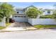Charming home exterior with a well-manicured lawn, a brick driveway, and a two-car garage at 1410 W New Hampshire St, Orlando, FL 32804