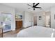 Comfortable main bedroom featuring a door to the balcony, TV, and ensuite bathroom at 1410 W New Hampshire St, Orlando, FL 32804