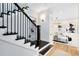 Elegant staircase with dark wood accents, open shelving, and stylish lighting fixtures at 1410 W New Hampshire St, Orlando, FL 32804