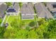 Aerial view of a home with a covered patio and a small backyard surrounded by a white fence at 1639 Balsam Willow Trl, Orlando, FL 32825
