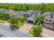 Aerial view of a two story home with a grey roof, lush lawn, and an attached two car garage at 1639 Balsam Willow Trl, Orlando, FL 32825