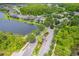 Aerial view of the community showing a lake and some of the neighborhood homes at 1639 Balsam Willow Trl, Orlando, FL 32825