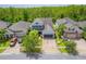Aerial view of a two story home with a grey roof, well-manicured lawn, and a brick driveway at 1639 Balsam Willow Trl, Orlando, FL 32825