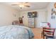 Bedroom featuring carpet, music stand, chair, ceiling fan, and a comfortable recliner at 1639 Balsam Willow Trl, Orlando, FL 32825