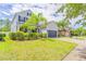Beautifully landscaped front yard showcasing a two-story home with a spacious two-car garage at 1639 Balsam Willow Trl, Orlando, FL 32825