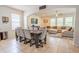 Open concept living area with tile floors connecting the living room and dining space at 1639 Balsam Willow Trl, Orlando, FL 32825