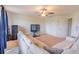 Spacious living room with large sectional, tv, ceiling fan and closet at 1639 Balsam Willow Trl, Orlando, FL 32825