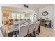 Bright, spacious living area featuring tile flooring, a large sectional sofa, and access to the backyard at 1639 Balsam Willow Trl, Orlando, FL 32825