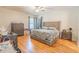 Bright main bedroom with hardwood floors, a ceiling fan, and dual windows at 1639 Balsam Willow Trl, Orlando, FL 32825