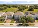 Aerial view of three two-story homes with well-maintained lawns and attached two-car garages at 16564 Silversaw Palm Dr, Winter Garden, FL 34787