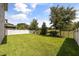Spacious backyard with a lush lawn and privacy fence at 16564 Silversaw Palm Dr, Winter Garden, FL 34787