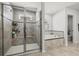 Bathroom features walk-in shower with built-in bench, soaking tub and tiled design at 16564 Silversaw Palm Dr, Winter Garden, FL 34787