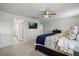 Comfortable bedroom showcasing a neatly made bed and access to an ensuite bathroom at 16564 Silversaw Palm Dr, Winter Garden, FL 34787