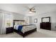 Bright main bedroom with a large bed, neutral walls, and plenty of natural light at 16564 Silversaw Palm Dr, Winter Garden, FL 34787