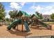 Community playground with slides, climbing wall, and covered platforms for outdoor fun at 16564 Silversaw Palm Dr, Winter Garden, FL 34787
