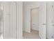 A bathroom features a glass enclosed shower, toilet and a door leading to another room at 2042 Education St, St Cloud, FL 34771