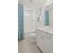 Bright bathroom features a shower-tub combo, vanity with drawers, and modern fixtures at 2042 Education St, St Cloud, FL 34771