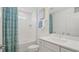 Bright bathroom features a shower-tub combo, vanity with drawers, and modern fixtures at 2042 Education St, St Cloud, FL 34771