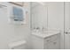Bright bathroom features a vanity with drawers, undermount sink, and modern fixtures at 2042 Education St, St Cloud, FL 34771