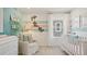Bright Bedroom with turtle wall decor and natural light at 2042 Education St, St Cloud, FL 34771