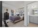 Comfortable bedroom with large bed, stylish decor, and an en-suite bathroom creating a cozy private retreat at 2042 Education St, St Cloud, FL 34771