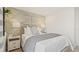 Comfortable bedroom featuring a geometric accent wall, modern decor, and soft lighting at 2042 Education St, St Cloud, FL 34771