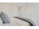 Clean bedroom with a sleek bed, plush pillows, and white linens at 2042 Education St, St Cloud, FL 34771