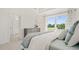 Bedroom with a large window, providing lots of natural light and a view outside at 2042 Education St, St Cloud, FL 34771