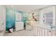 Ocean-themed Bedroom design with a crib, decorative accents, and plenty of natural light at 2042 Education St, St Cloud, FL 34771