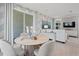 Stylish dining area featuring modern furniture and seamless access to outdoor living at 2042 Education St, St Cloud, FL 34771
