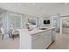Bright eat-in kitchen with a large center island, stainless appliances, and modern lighting at 2042 Education St, St Cloud, FL 34771