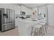 Modern kitchen features stainless steel appliances and a large center island with seating at 2042 Education St, St Cloud, FL 34771