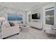 Comfortable living room featuring neutral colors, stylish furniture, and plenty of natural light at 2042 Education St, St Cloud, FL 34771