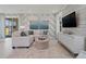 Inviting living room with stylish decor, large windows, and comfortable seating at 2042 Education St, St Cloud, FL 34771
