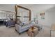 Upstairs living room, with gray sectional couch, separation from bedroom and bathroom at 2042 Education St, St Cloud, FL 34771